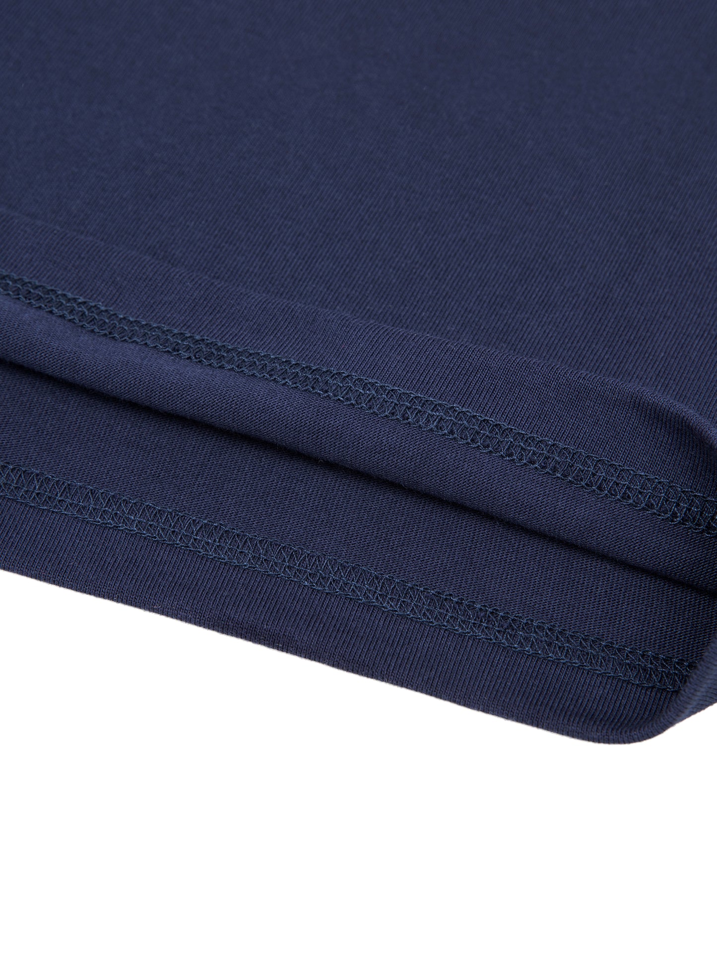 Close-up of a navy blue Tshirt with stitching detail on a white background